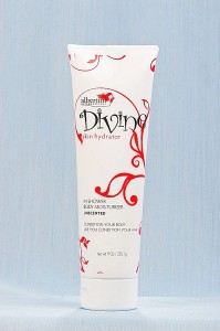 A tube of lotion with red swirls on it.