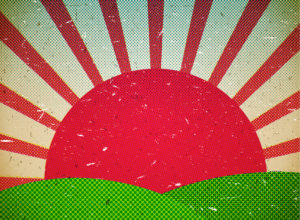 A red sun setting over the green hills.