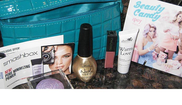 A table with makeup and cosmetics on it.